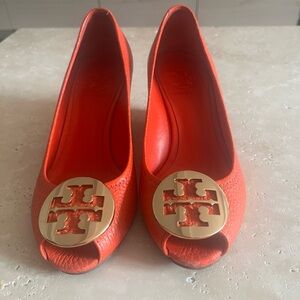 Open toed orange Tory Burch wedges